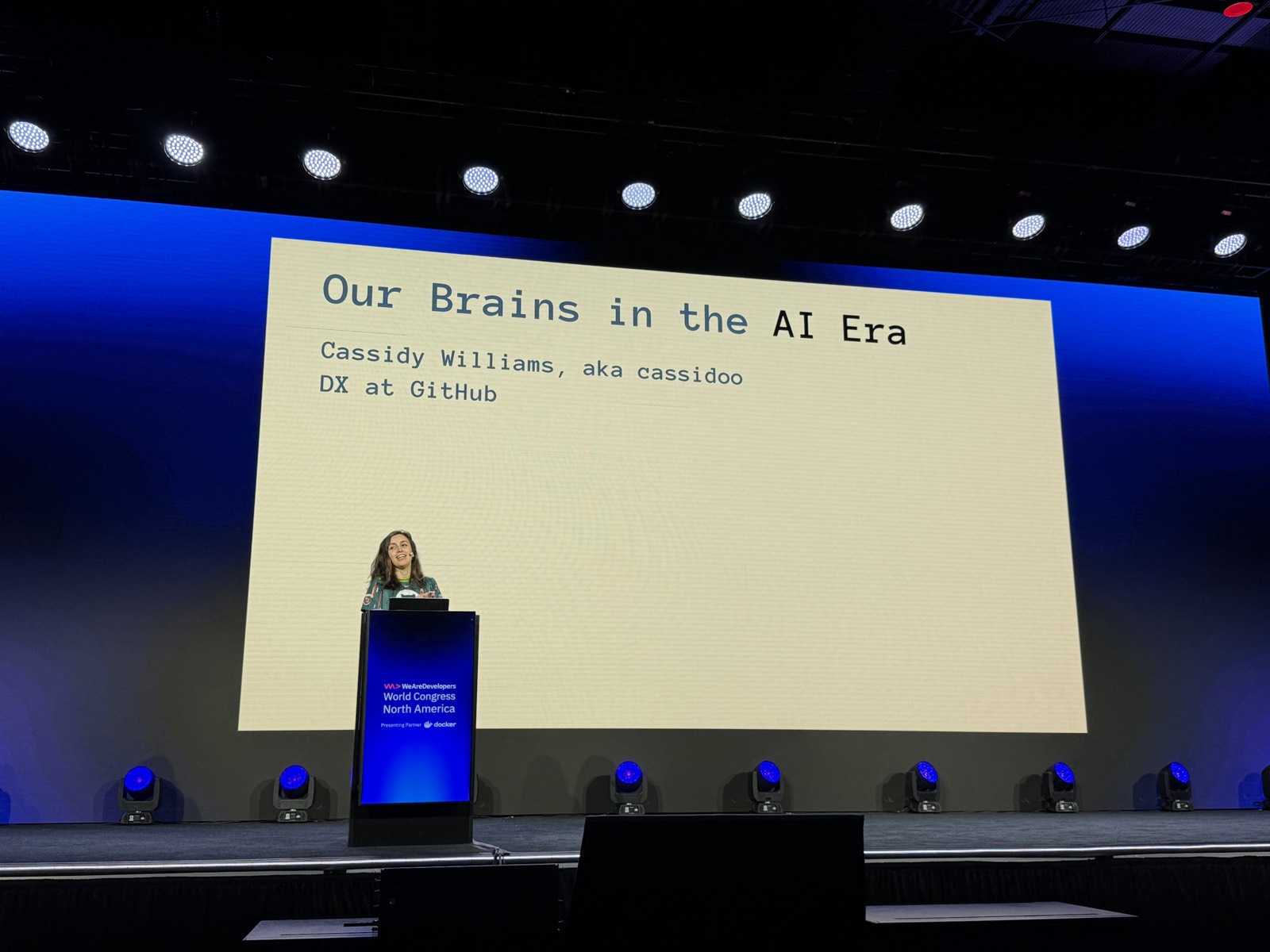 Slide mở đầu Our Brains in the AI Era, Cassidy Williams aka cassidoo, DX at GitHub